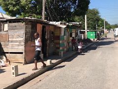 11A Looking down 3rd Street with a colourful shack house Trench Town Kingston Jamaica